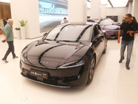 A customer experiences a smart car with Harmony OS autonomous driving technology at Huawei's flagship store in Shanghai, China, on October 1...