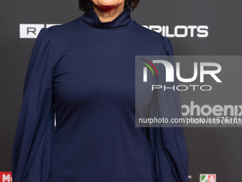 Sandra Maischberger, a German talk show host, stands on the red carpet during the opening of the Cologne Film Festival 2024 at Film Palast i...