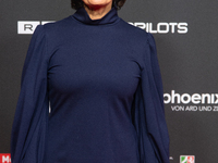 Sandra Maischberger, a German talk show host, stands on the red carpet during the opening of the Cologne Film Festival 2024 at Film Palast i...