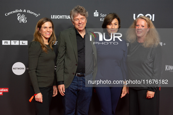 Dr. Caroline Volkmann, Andres Veiel, Sandra Maischberger, and Christiane Hinz stand on the red carpet during the opening of the Cologne Film...