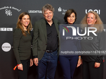 Dr. Caroline Volkmann, Andres Veiel, Sandra Maischberger, and Christiane Hinz stand on the red carpet during the opening of the Cologne Film...