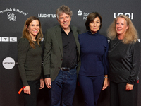 Dr. Caroline Volkmann, Andres Veiel, Sandra Maischberger, and Christiane Hinz stand on the red carpet during the opening of the Cologne Film...