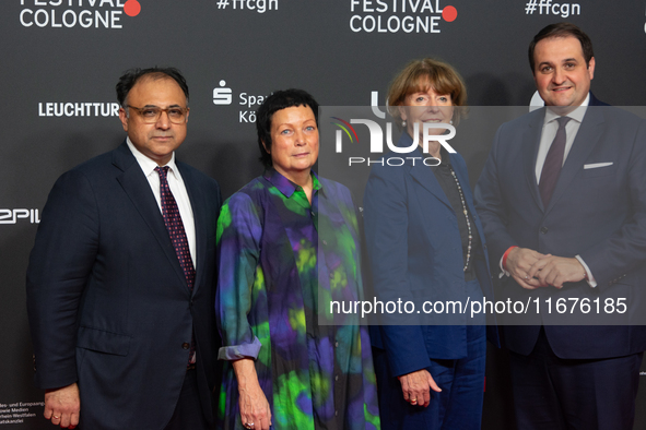 Waid Nakschbandi, Martina Richter, Henriette Reker, and Nathanael Liminski stand on the red carpet during the opening of the Cologne Film Fe...