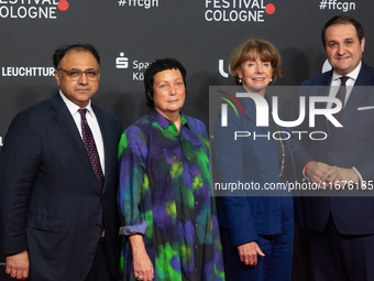 Waid Nakschbandi, Martina Richter, Henriette Reker, and Nathanael Liminski stand on the red carpet during the opening of the Cologne Film Fe...