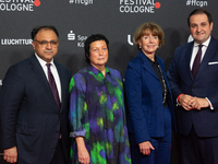 Waid Nakschbandi, Martina Richter, Henriette Reker, and Nathanael Liminski stand on the red carpet during the opening of the Cologne Film Fe...