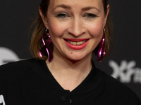 Loretta Stern, a German actress, stands on the red carpet during the opening of the Cologne Film Festival 2024 at Film Palast in Cologne, Ge...