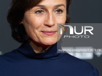 Sandra Maischberger, a German talk show host, stands on the red carpet during the opening of the Cologne Film Festival 2024 at Film Palast i...