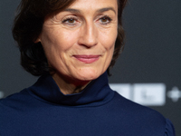 Sandra Maischberger, a German talk show host, stands on the red carpet during the opening of the Cologne Film Festival 2024 at Film Palast i...