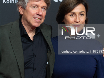 Andres Veiel, a German director, and Sandra Maischberger, a German talk show host, stand on the red carpet during the opening of the Cologne...