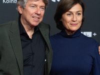 Andres Veiel, a German director, and Sandra Maischberger, a German talk show host, stand on the red carpet during the opening of the Cologne...