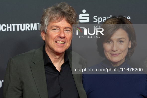 Andres Veiel, a German director, and Sandra Maischberger, a German talk show host, stand on the red carpet during the opening of the Cologne...