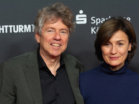 Andres Veiel, a German director, and Sandra Maischberger, a German talk show host, stand on the red carpet during the opening of the Cologne...