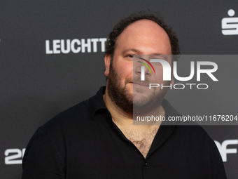 Marshall, a German actor, stands on the red carpet during the opening of the Cologne Film Festival 2024 at Film Palast in Cologne, Germany,...