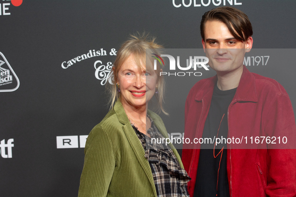 Therese Hamer, a German actress, and Joscha Baltha, a German actor, stand on the red carpet during the opening of the Cologne Film Festival...