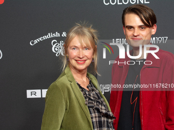 Therese Hamer, a German actress, and Joscha Baltha, a German actor, stand on the red carpet during the opening of the Cologne Film Festival...