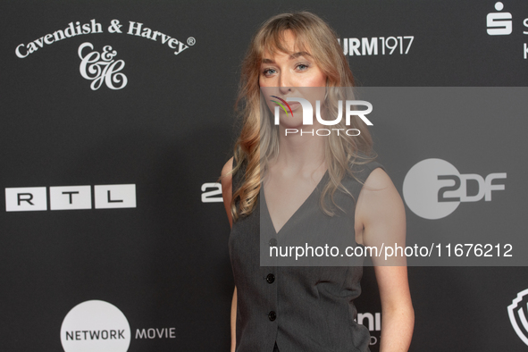 Ricarda Richter, a German actress, stands on the red carpet during the opening of the Cologne Film Festival 2024 at Film Palast in Cologne,...