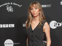 Ricarda Richter, a German actress, stands on the red carpet during the opening of the Cologne Film Festival 2024 at Film Palast in Cologne,...