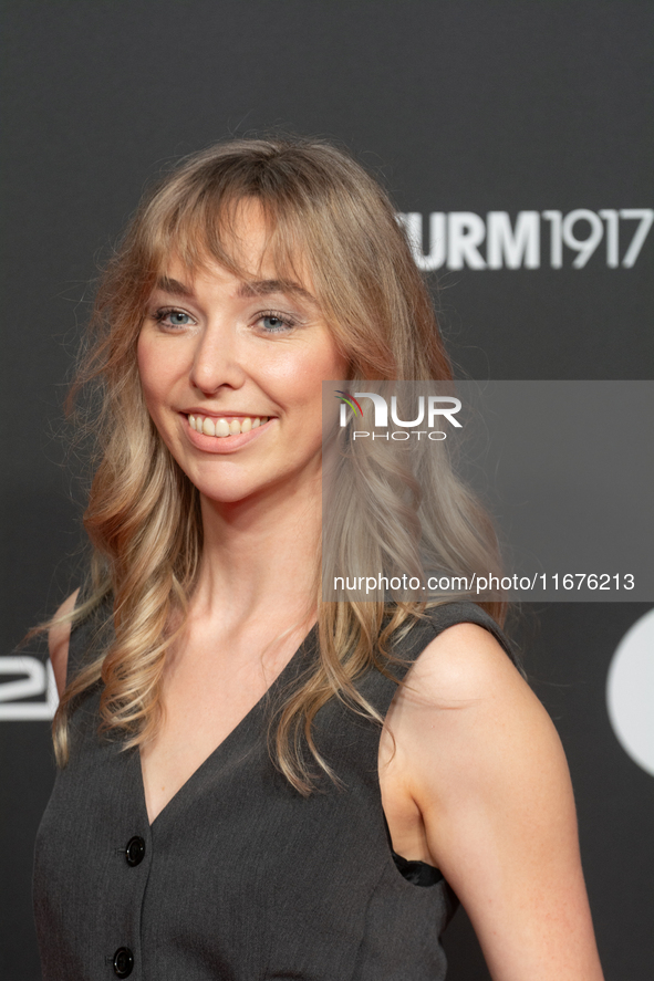 Ricarda Richter, a German actress, stands on the red carpet during the opening of the Cologne Film Festival 2024 at Film Palast in Cologne,...