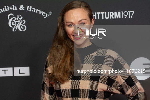 Julia Wiedemann, a German actress, stands on the red carpet during the opening of the Cologne Film Festival 2024 at Film Palast in Cologne,...