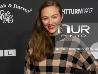 Julia Wiedemann, a German actress, stands on the red carpet during the opening of the Cologne Film Festival 2024 at Film Palast in Cologne,...