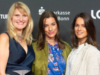 Corinna Nilson, a German actress, Antje Hamer, a German actress, and Leni Adams, a German actress, stand on the red carpet during the openin...