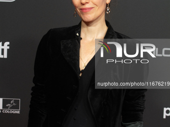 Antonia Bergman, a German actress, stands on the red carpet during the opening of the Cologne Film Festival 2024 at Film Palast in Cologne,...