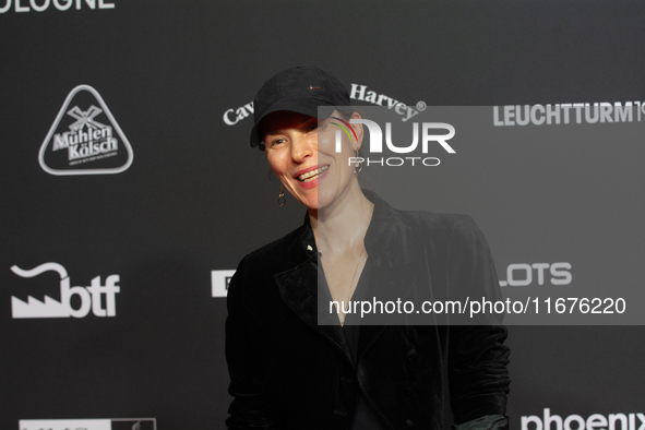 Antonia Bergman, a German actress, stands on the red carpet during the opening of the Cologne Film Festival 2024 at Film Palast in Cologne,...