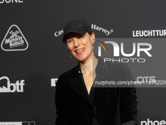 Antonia Bergman, a German actress, stands on the red carpet during the opening of the Cologne Film Festival 2024 at Film Palast in Cologne,...