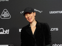 Antonia Bergman, a German actress, stands on the red carpet during the opening of the Cologne Film Festival 2024 at Film Palast in Cologne,...