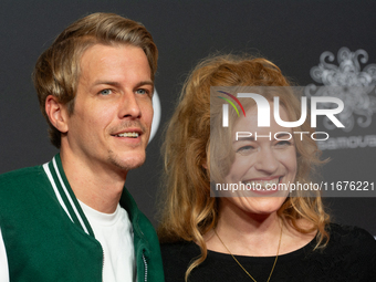 Madeleine Krakor, a German actress, and Sebastian Kolb, a German actor, stand on the red carpet during the opening of the Cologne Film Festi...