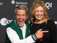 Madeleine Krakor, a German actress, and Sebastian Kolb, a German actor, stand on the red carpet during the opening of the Cologne Film Festi...