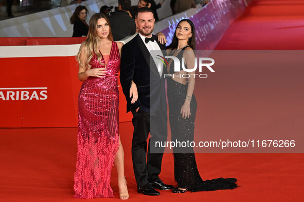 Beatrice Nardi, Antonello Lauretti, and Giulia Acri attend the ''Paradiso in vendita'' red carpet during the 19th Rome Film Festival at Audi...