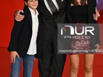 Luca Barbareschi and a guest attend the ''Paradiso in vendita'' red carpet during the 19th Rome Film Festival at Auditorium Parco Della Musi...