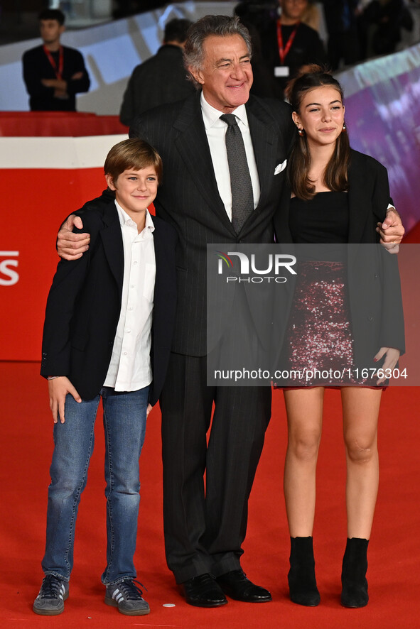 Luca Barbareschi and a guest attend the ''Paradiso in vendita'' red carpet during the 19th Rome Film Festival at Auditorium Parco Della Musi...