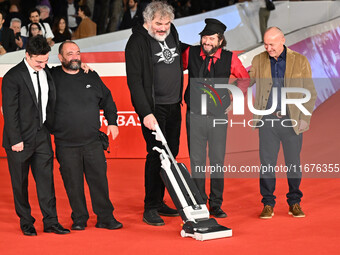 (L-R) Gianfranco Firriolo, Donatello Racina, Marco Cervetti, Vinicio Capossela, and a guest attend the ''Natale fuori orario'' red carpet du...