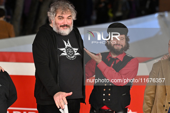 Marco Cervetti, Vinicio Capossela, and a guest attend the ''Natale fuori orario'' red carpet during the 19th Rome Film Festival at Auditoriu...