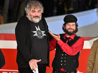 Marco Cervetti, Vinicio Capossela, and a guest attend the ''Natale fuori orario'' red carpet during the 19th Rome Film Festival at Auditoriu...