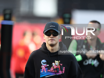 Sauber driver Zhou Guanyu, 24, arrives in the paddock at Circuit of the Americas in Austin, Texas, on October 17, 2024. (