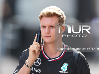 Mick Schumacher arrives in the paddock at Circuit of the Americas in Austin, Texas, on October 17, 2024. (