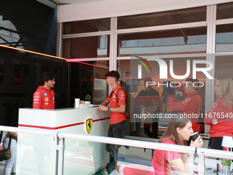 Carlos Sainz and Oliver Bearman are in the Ferrari Hospitality Suite in the paddock at Circuit of the Americas in Austin, Texas, on October...