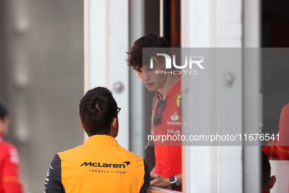 Oliver Bearman speaks to a McLaren team member from outside the Ferrari Hospitality Suite in the paddock at Circuit of the Americas in Austi...