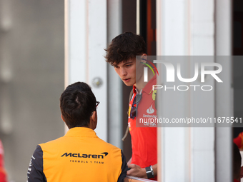 Oliver Bearman speaks to a McLaren team member from outside the Ferrari Hospitality Suite in the paddock at Circuit of the Americas in Austi...