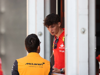 Oliver Bearman speaks to a McLaren team member from outside the Ferrari Hospitality Suite in the paddock at Circuit of the Americas in Austi...