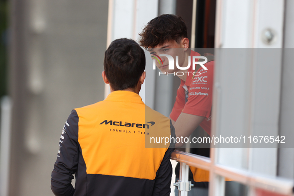 Oliver Bearman speaks to a McLaren team member from outside the Ferrari Hospitality Suite in the paddock at Circuit of the Americas in Austi...