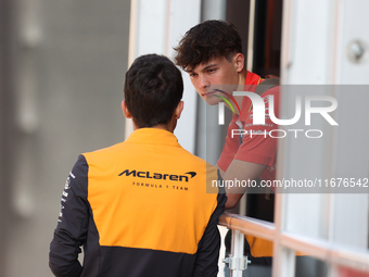 Oliver Bearman speaks to a McLaren team member from outside the Ferrari Hospitality Suite in the paddock at Circuit of the Americas in Austi...