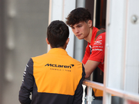 Oliver Bearman speaks to a McLaren team member from outside the Ferrari Hospitality Suite in the paddock at Circuit of the Americas in Austi...