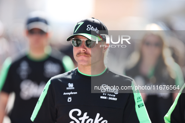 Sauber driver Valtteri Bottas (77) walks in the paddock at Circuit of the Americas in Austin, Texas, on October 17, 2024. 