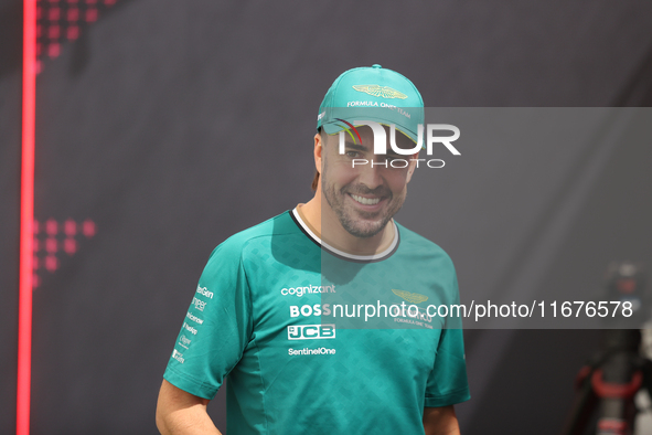 Aston Martin driver Fernando Alonso (14) speaks to the press in the paddock at Circuit of the Americas in Austin, Texas, on October 17, 2024...