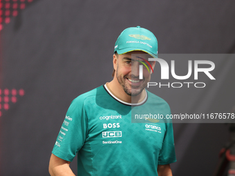 Aston Martin driver Fernando Alonso (14) speaks to the press in the paddock at Circuit of the Americas in Austin, Texas, on October 17, 2024...