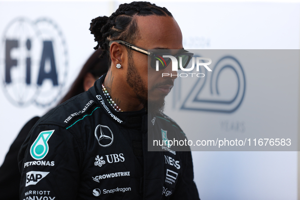 Lewis Hamilton walks in the paddock at Circuit of the Americas in Austin, Texas, on October 17, 2024. 